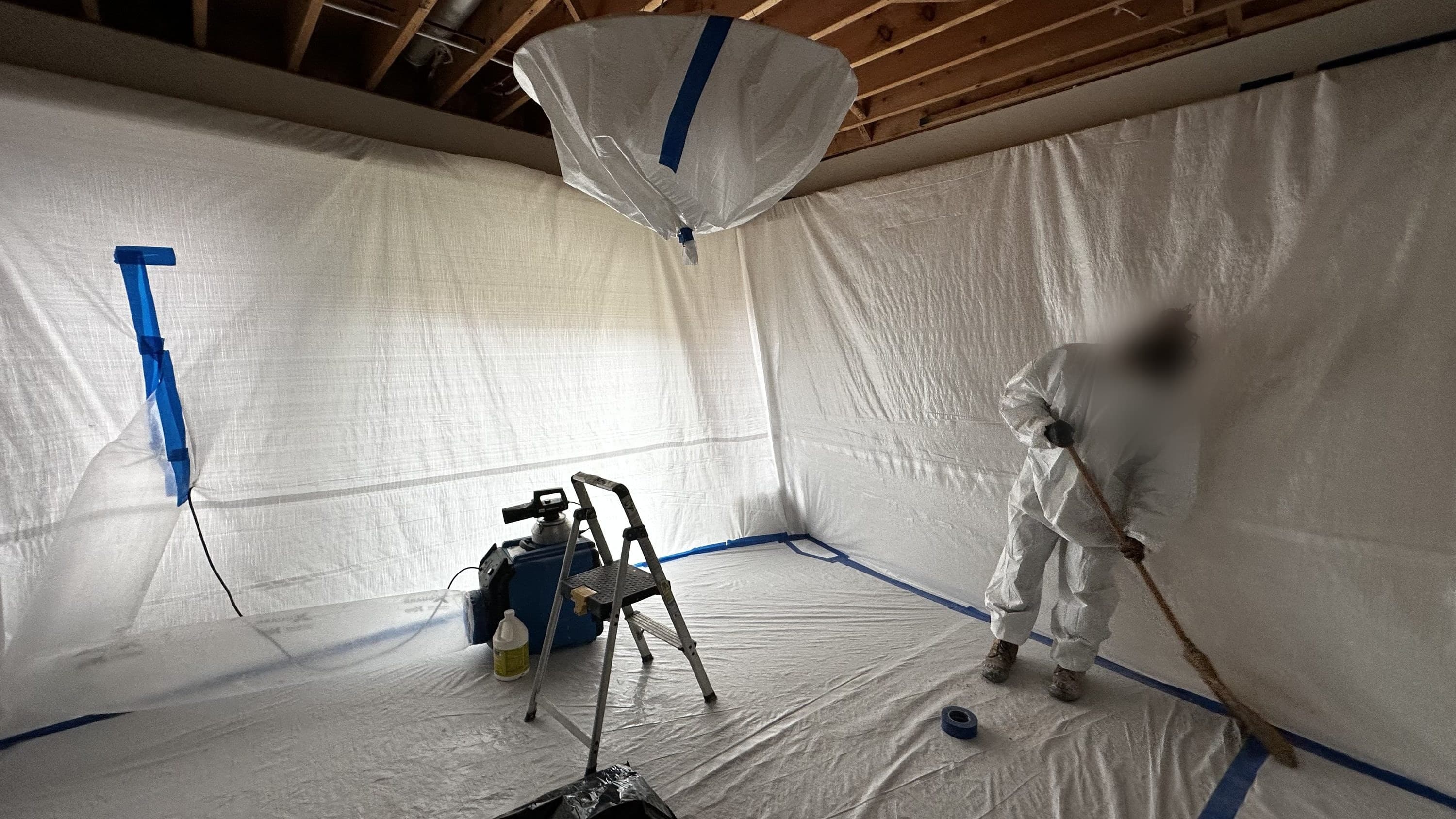 Safeway technicians building a containment area during an abatement project
